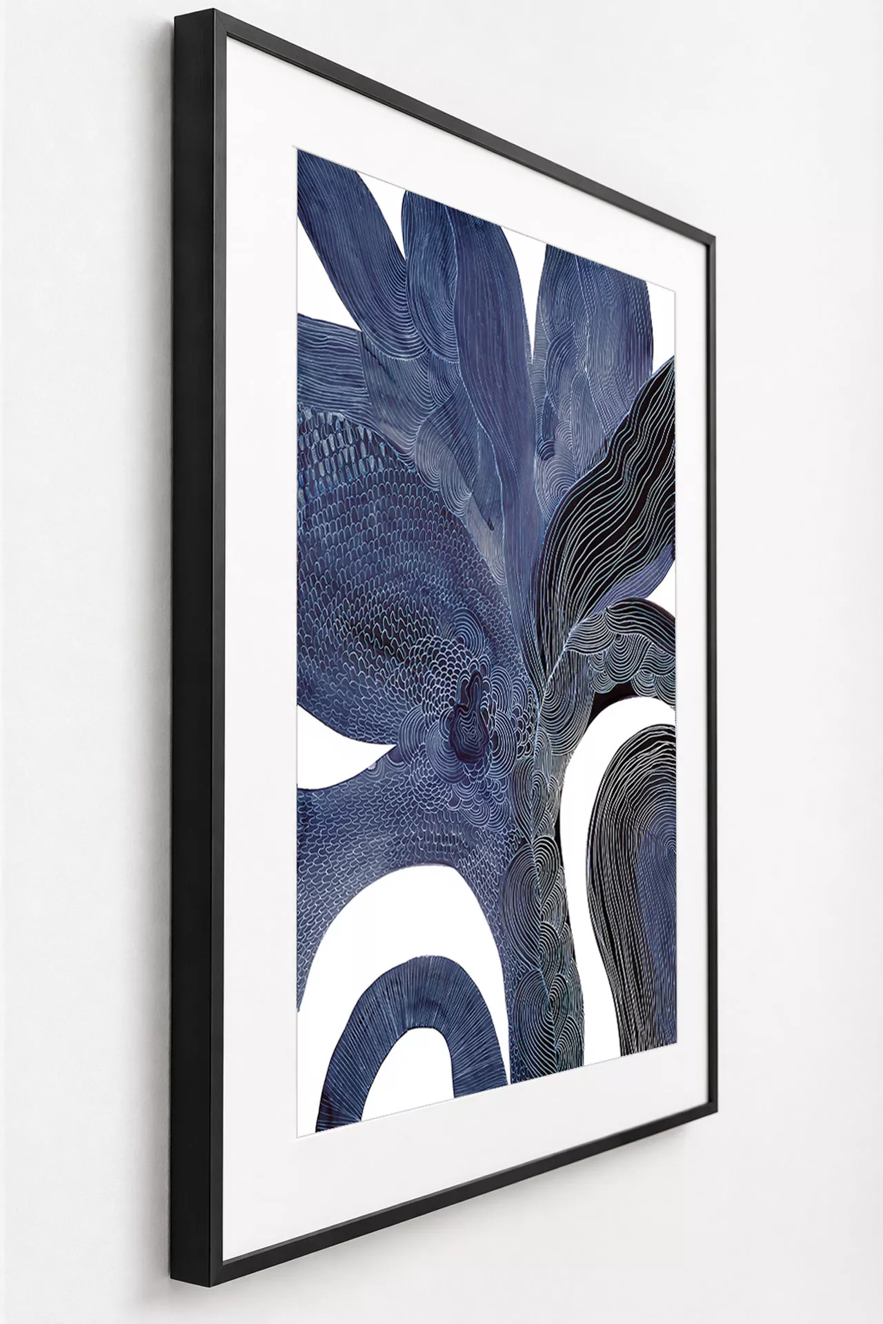 PETULA framed fine art print in indigo, angled side view showing the matte black frame profile